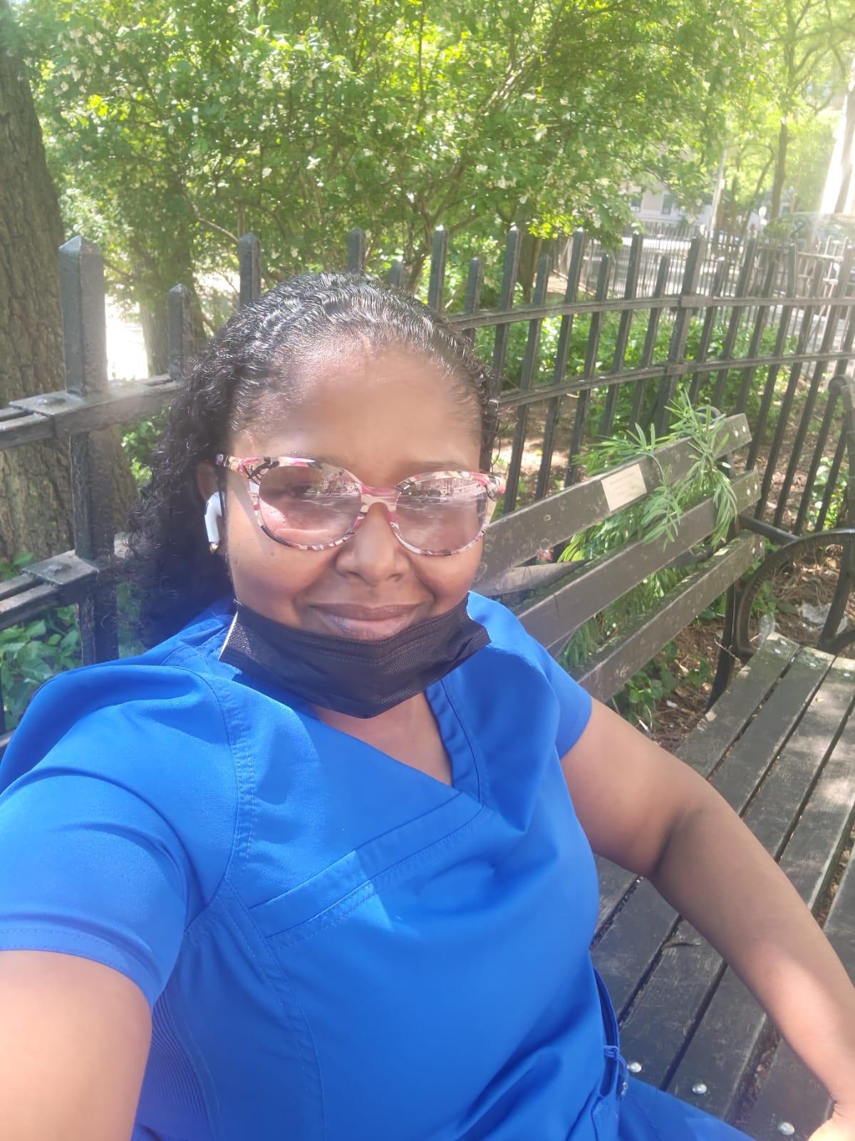 Caregiver helping elderly woman at home