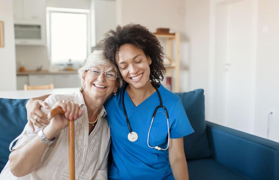 Caregiver and senior sharing a warm moment